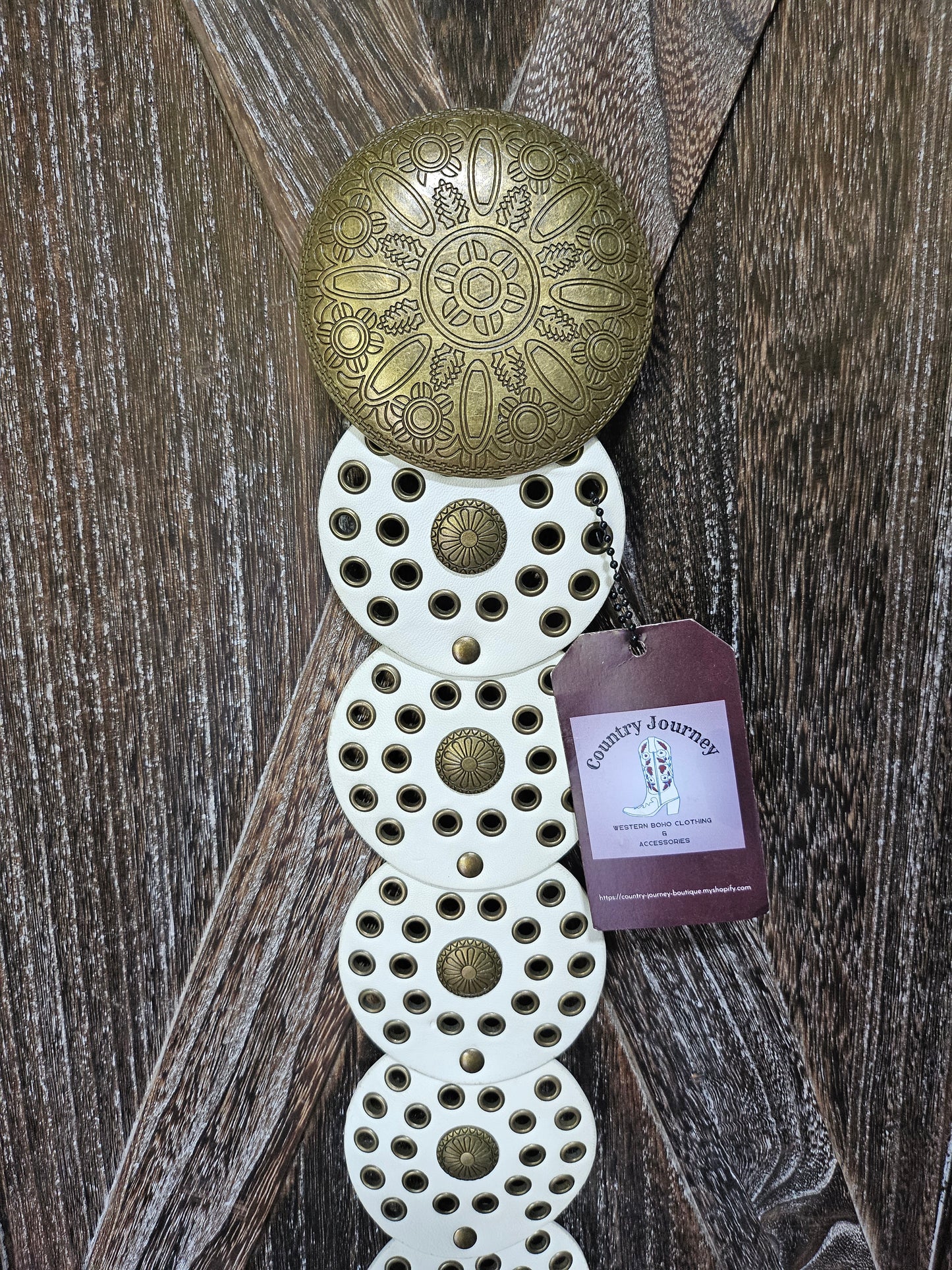 White and gold disc waist belt with gold buckle