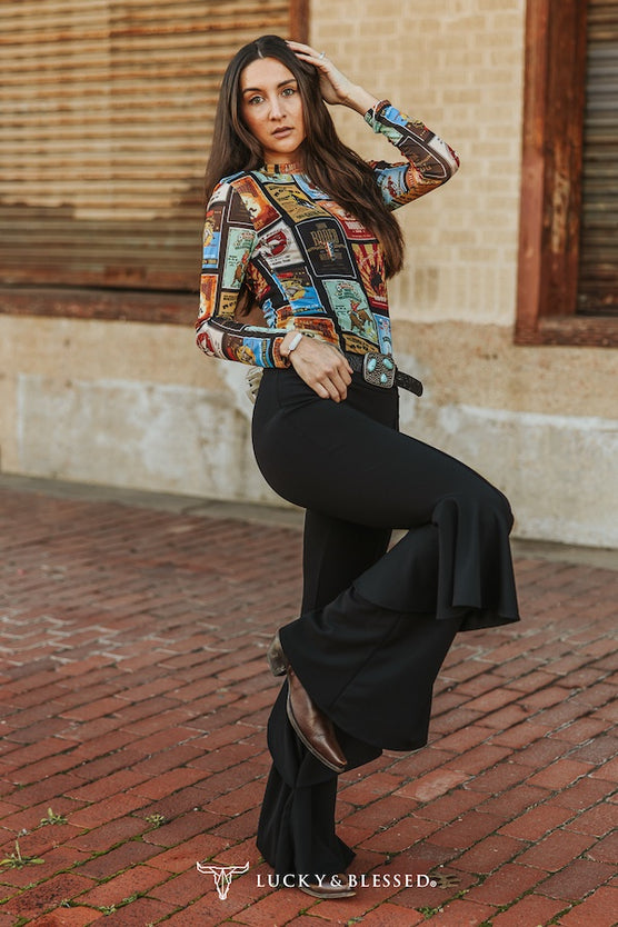 Black flare stretch pants with bell ruffle bottoms