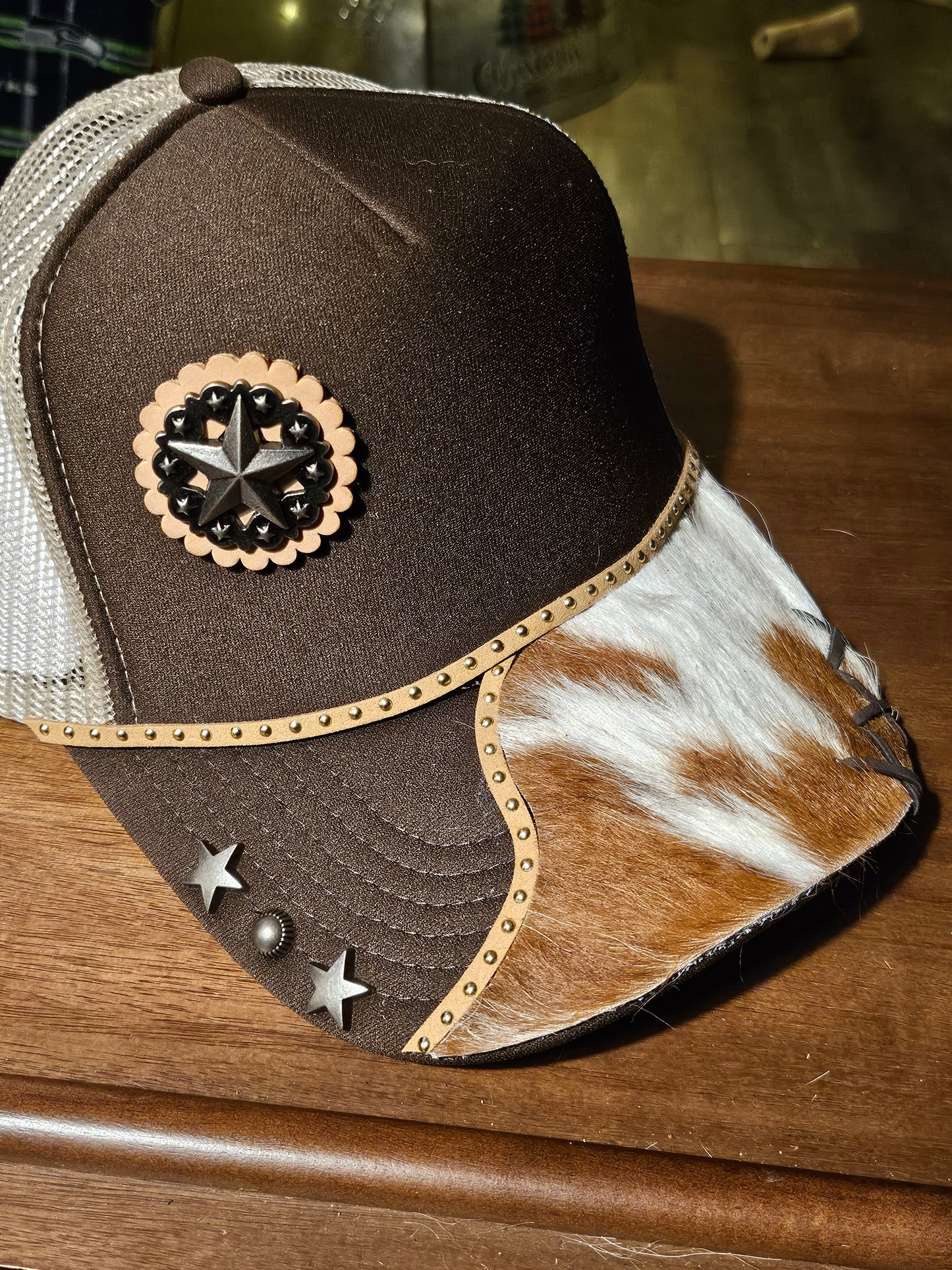 Western trucker hat with cowhide and conchos