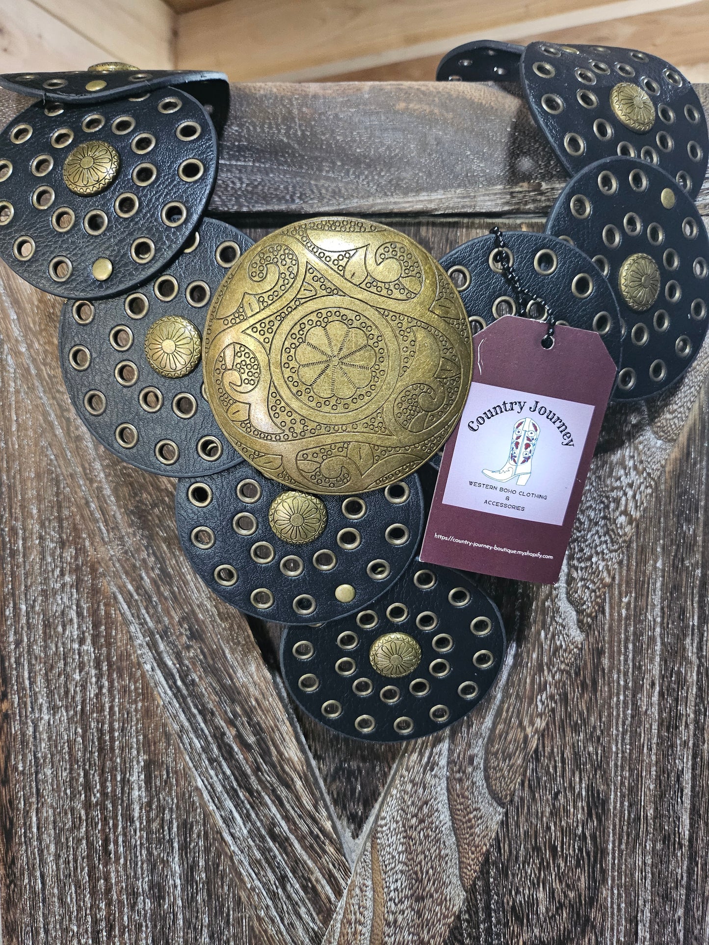Black disc belt with gold buckle