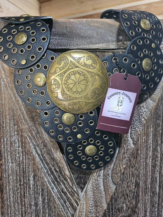 Black disc belt with gold buckle