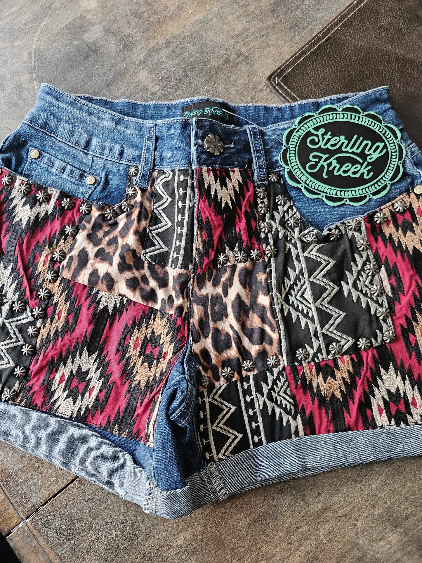 Patched Up Denim Shorts-In Red Aztec And Leopard Print