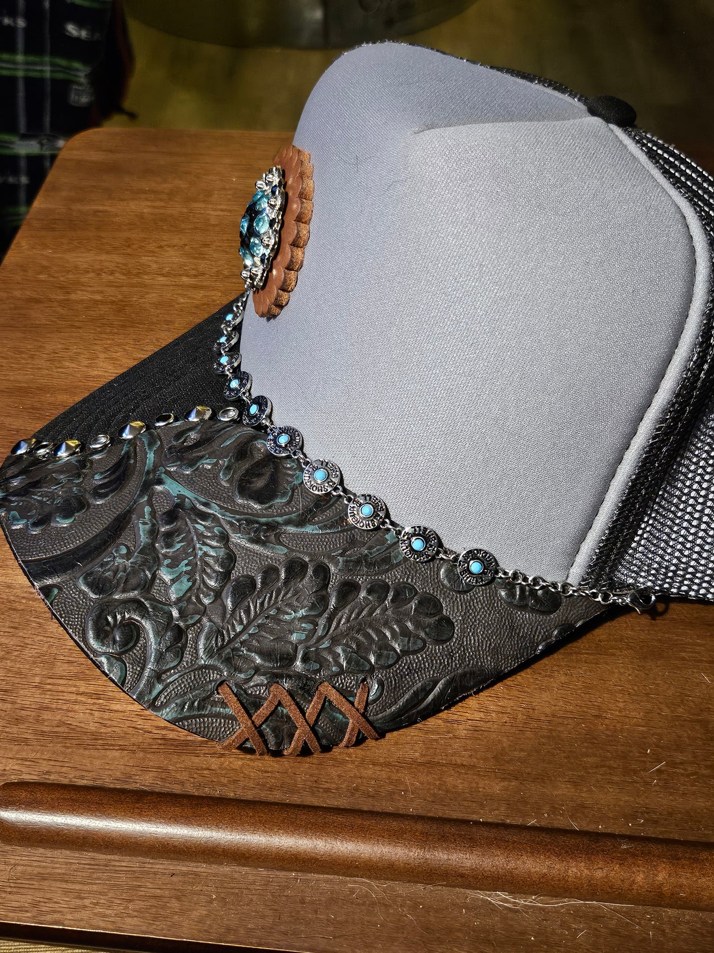 Western trucker hat with cowhide and conchos