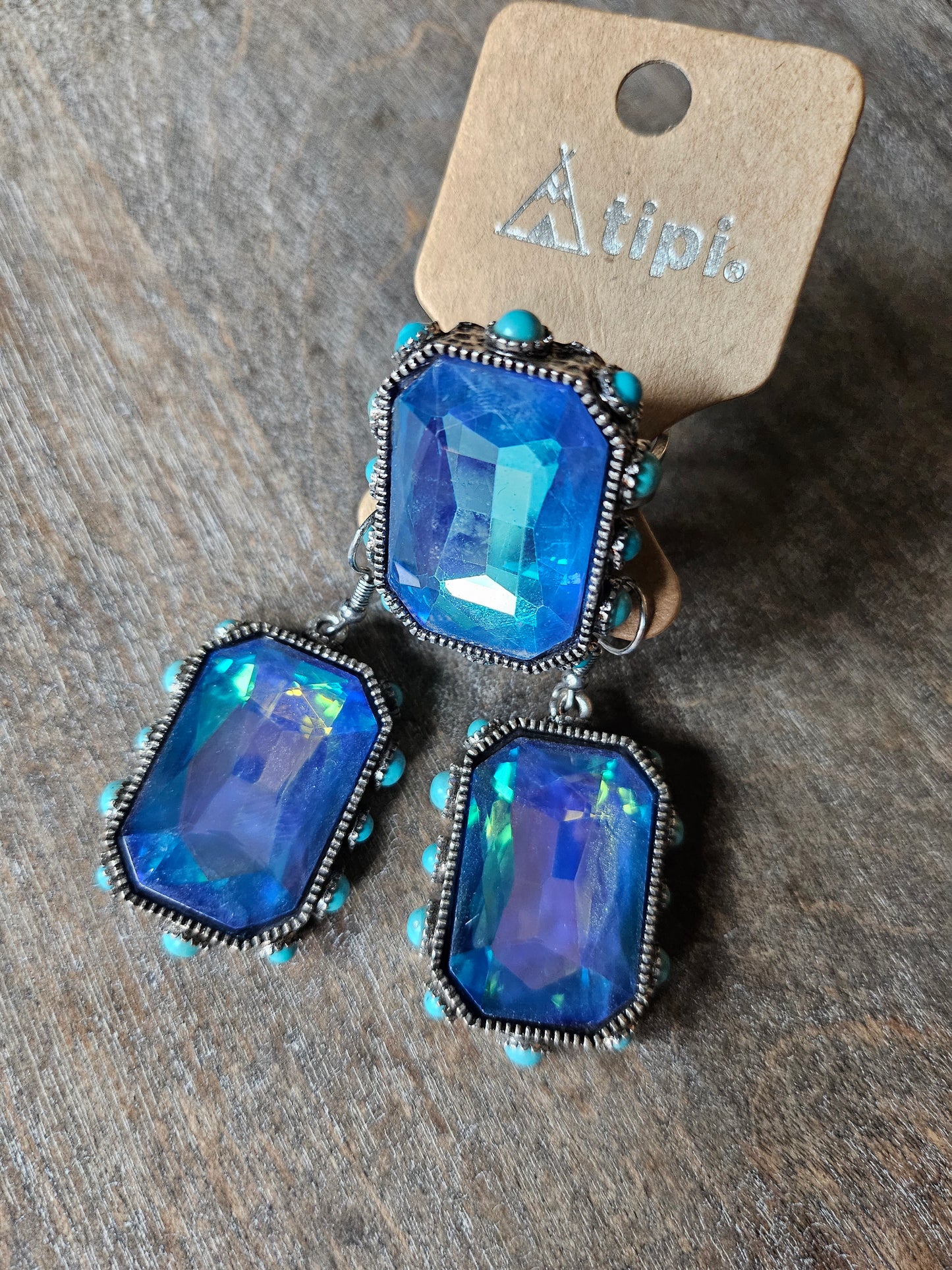 Blue iridescent stone and turquoise ring with matching earrings.