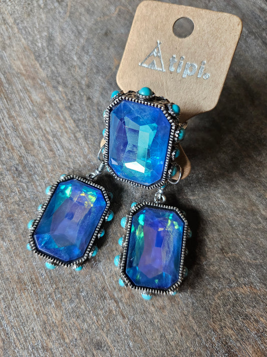 Blue iridescent stone and turquoise ring with matching earrings.