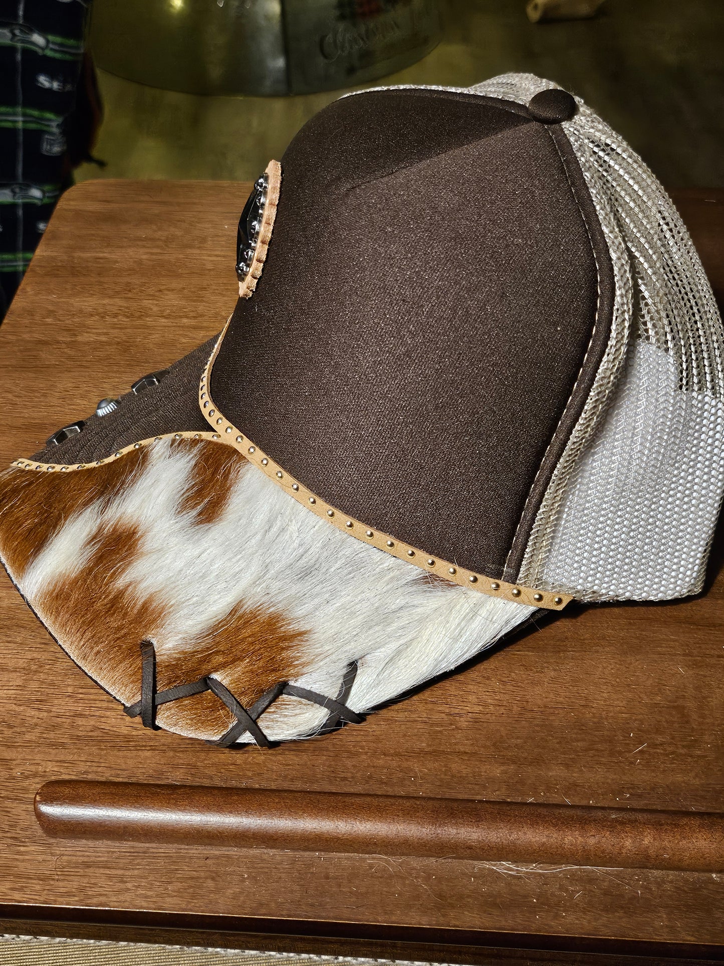 Western trucker hat with cowhide and conchos