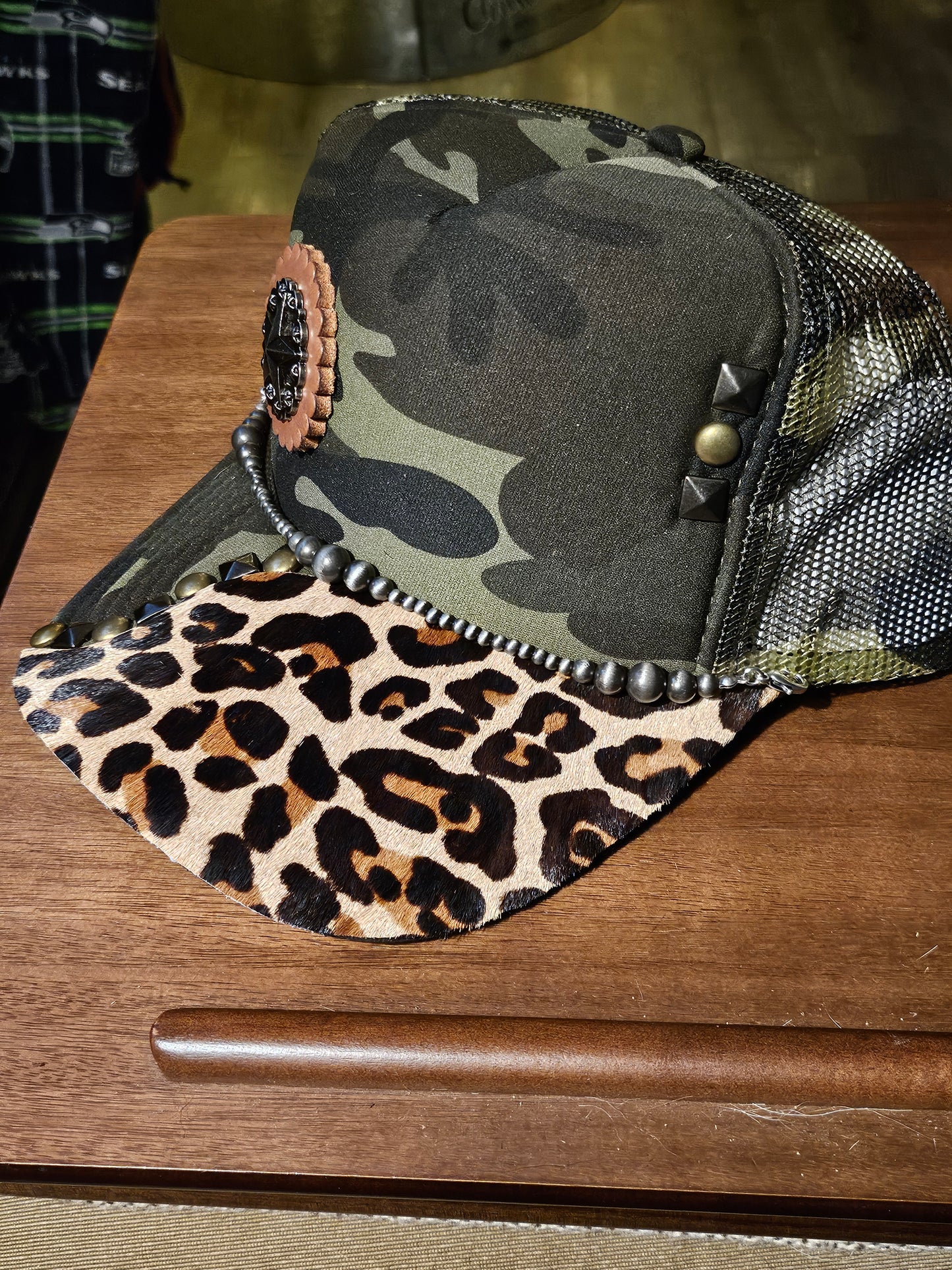 Western trucker hat with cowhide and conchos