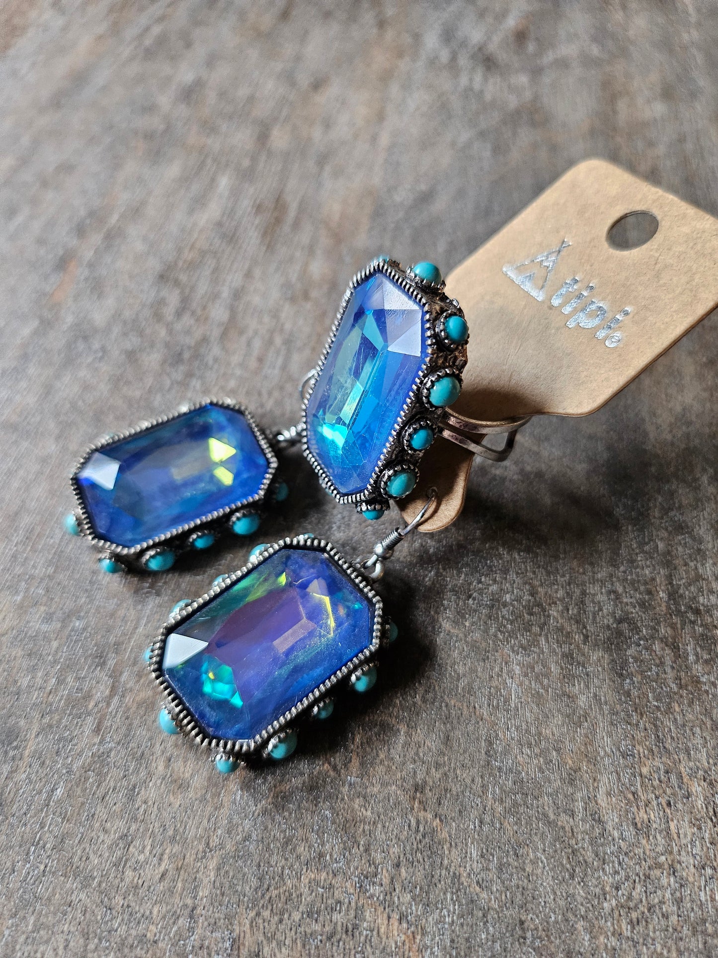 Blue iridescent stone and turquoise ring with matching earrings.