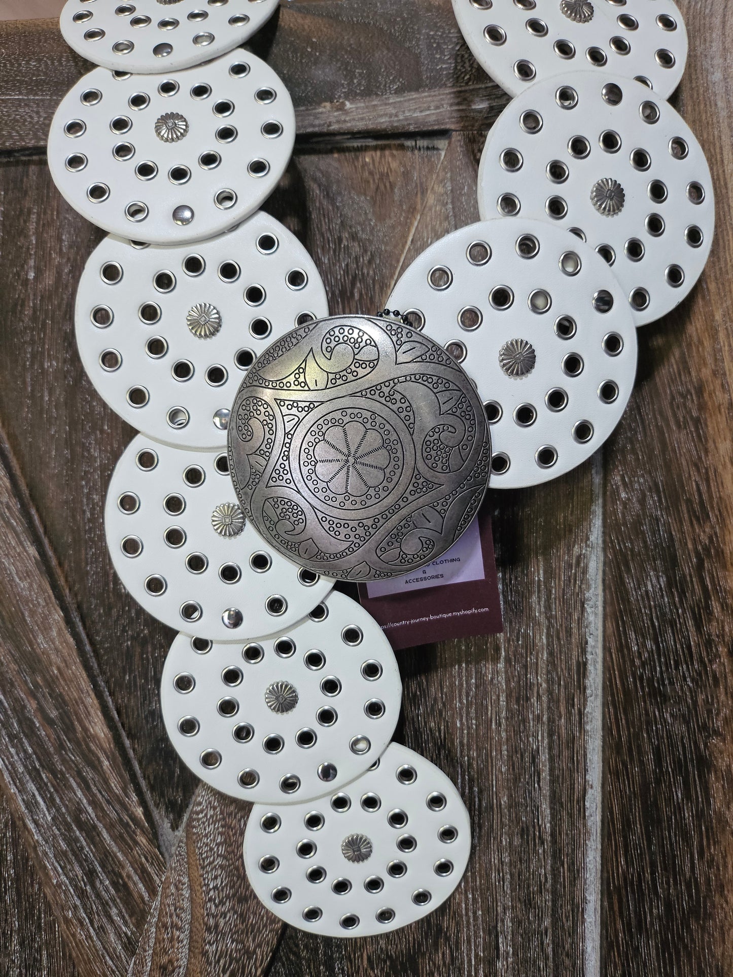 White disc waist belt with silver buckle