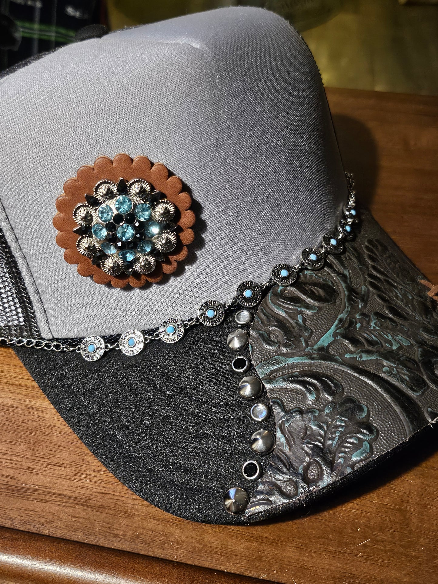 Western trucker hat with cowhide and conchos