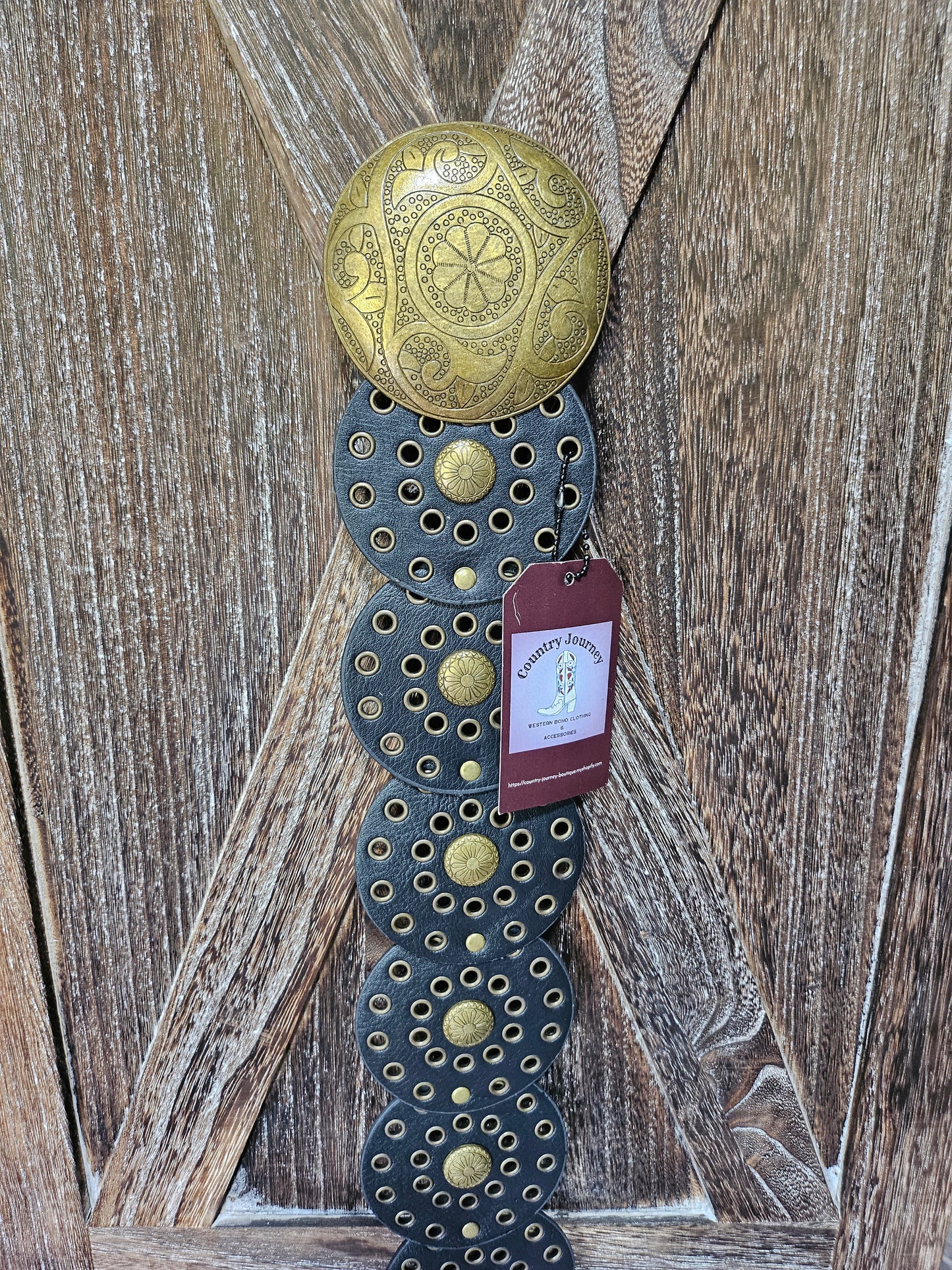 Black disc belt with gold buckle