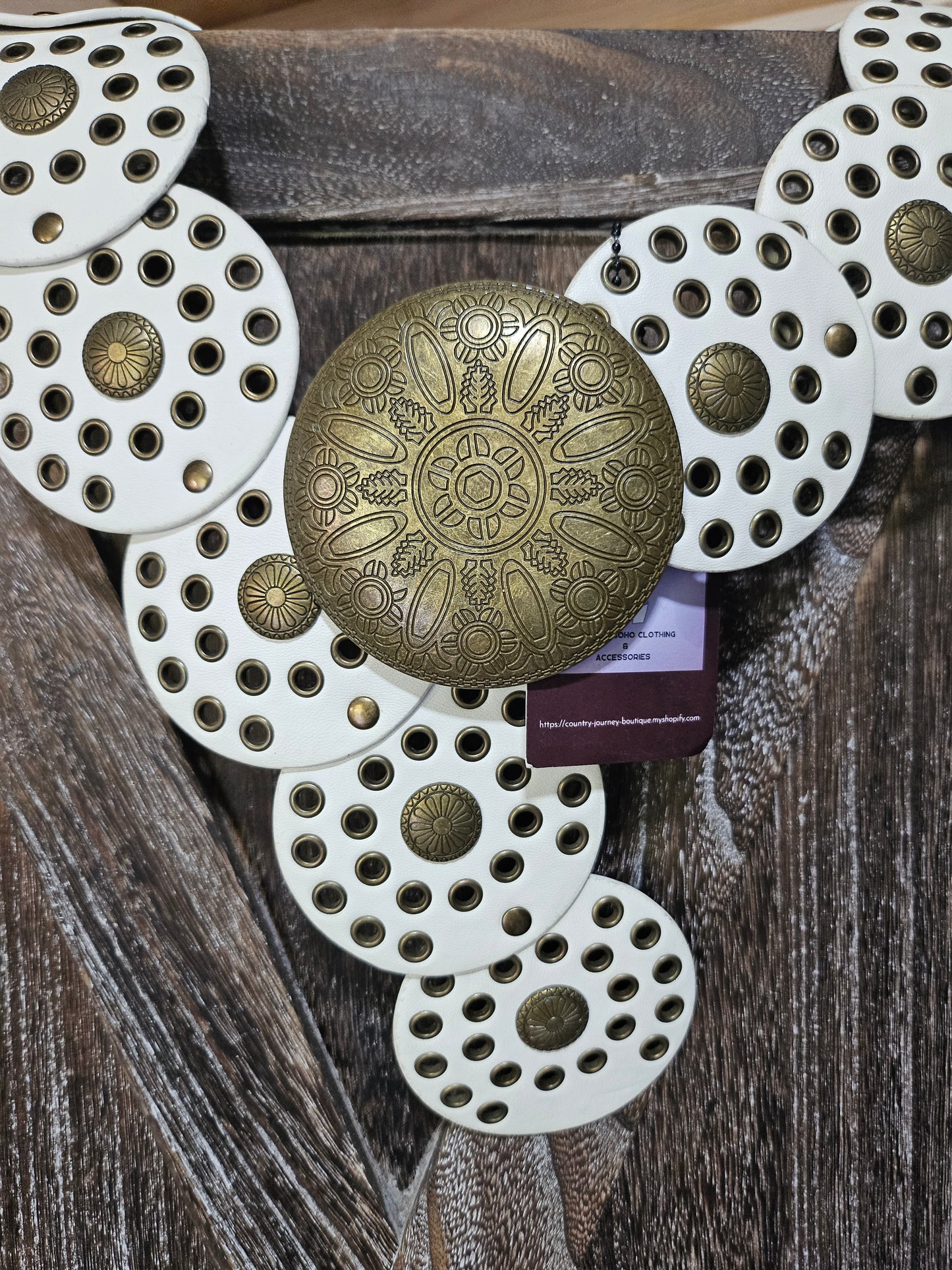 White and gold disc waist belt with gold buckle
